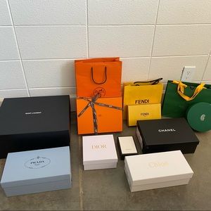 Collection of EMPTY boxes, bags, and ribbons from luxury designers.